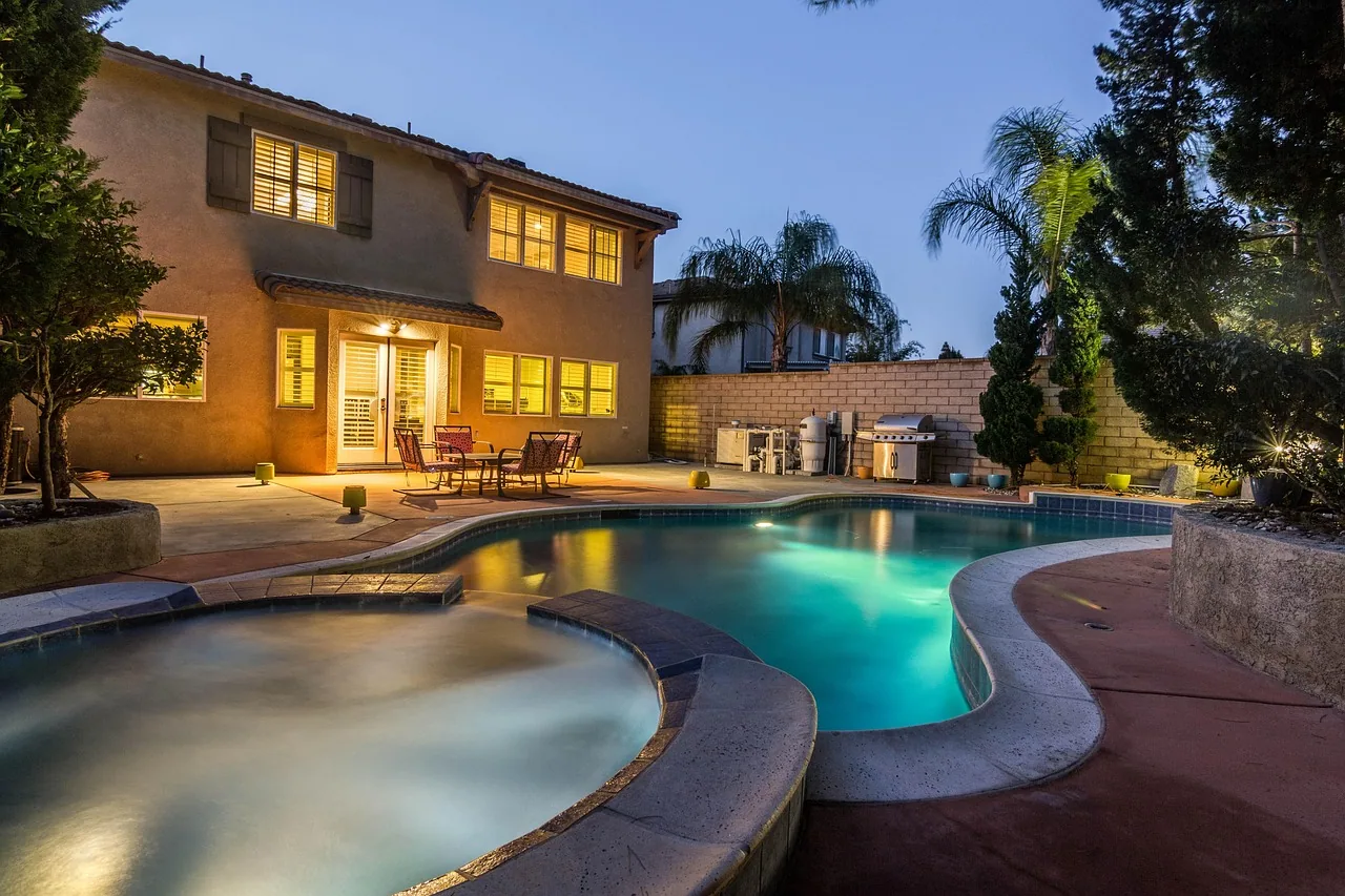Backyard pool spa patio dusk stucco home outdoor lighting irmo SC