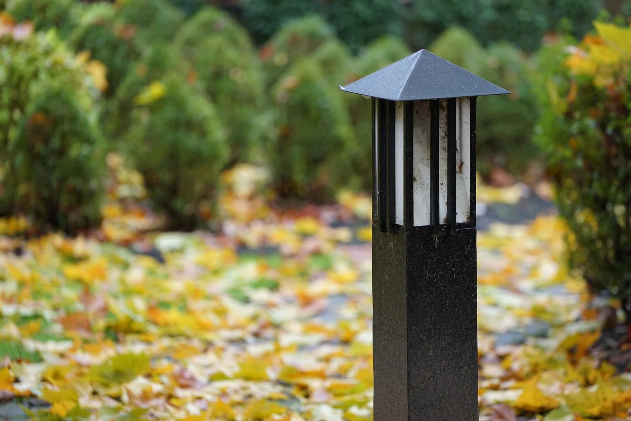 Pagoda style bollard light fallen autumn leaves boxwoods cayce SC
